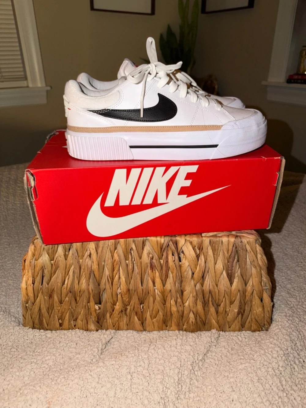 Nike White Low-Top Sneakers with Black Swoosh and Tan Stripe